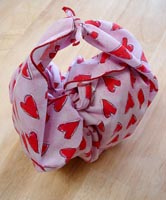A quick how-to:  The furoshiki purse-tie